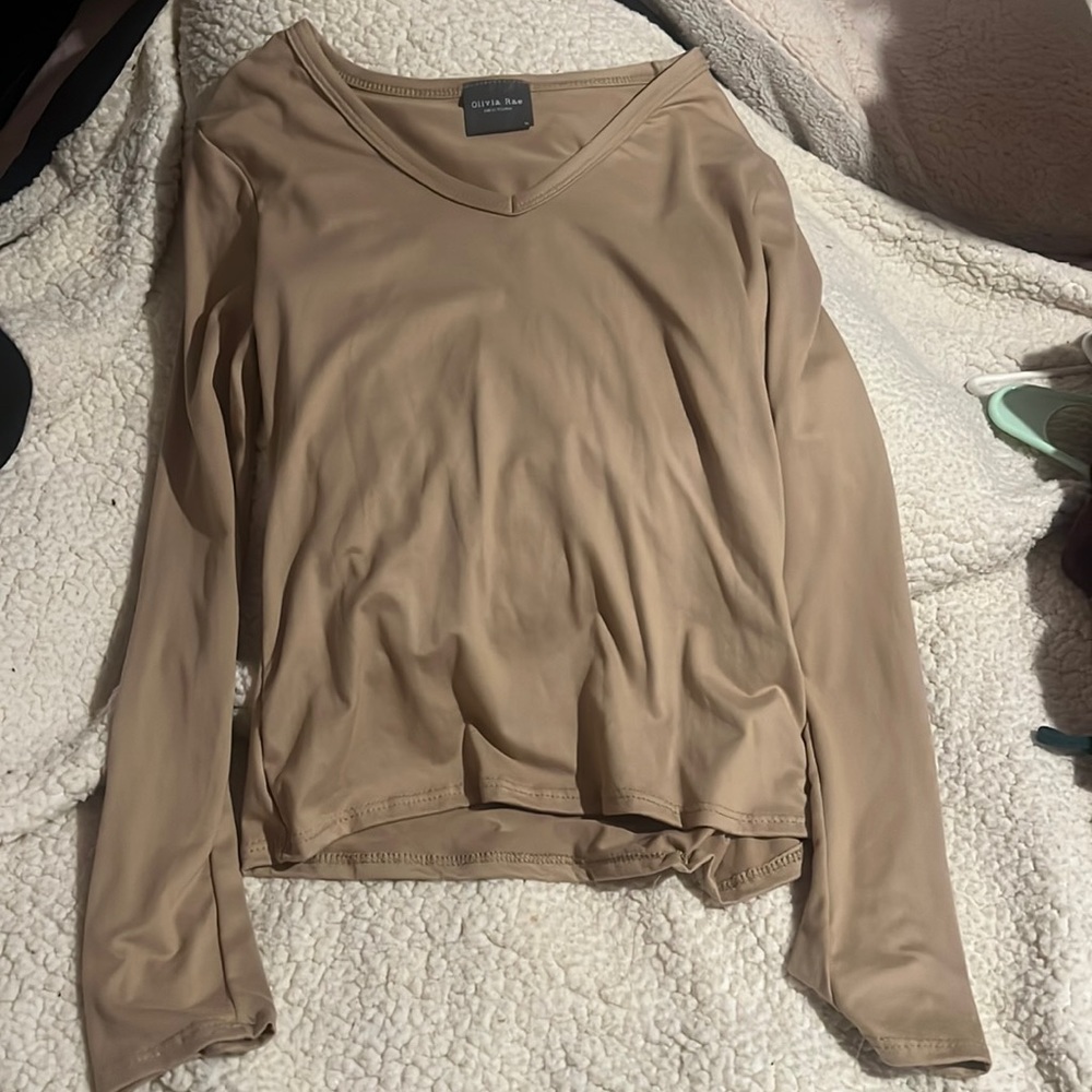 tan shirt , kinda tight